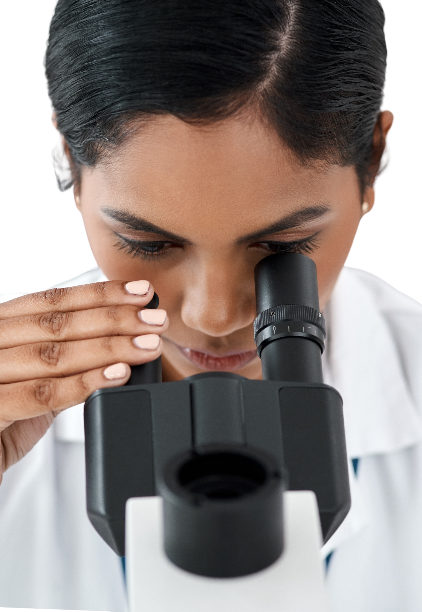 The lady carefully examines the eye lens through a pair of binoculars, her focused gaze highlighting the precision and attention to detail as she assesses its clarity and quality